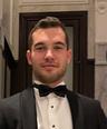 Kerem Bayraktaroglu, CEO at Becergen, professional headshot in tuxedo.